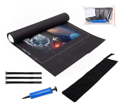 Black mat with space-themed design, blue pump, and black straps on a white background