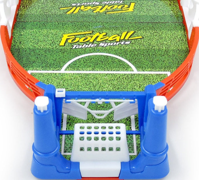 Tabletop football game with green playing field and blue goal posts on a white background