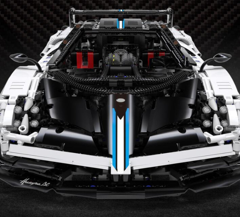 Model car built from interlocking bricks with a detailed engine bay on a dark background