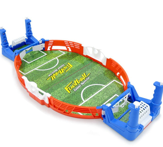 Toy football field with goalposts on a white background
