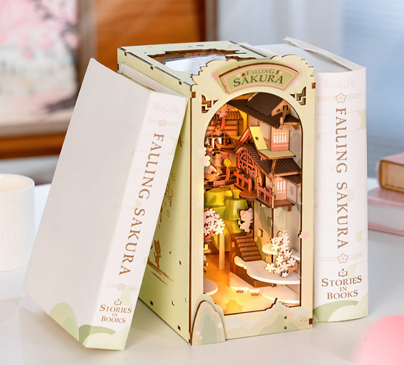 Book-shaped box with a miniature dollhouse inside, titled 'Falling Sakura'.