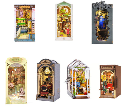 Collection of miniature model houses in various designs and settings.