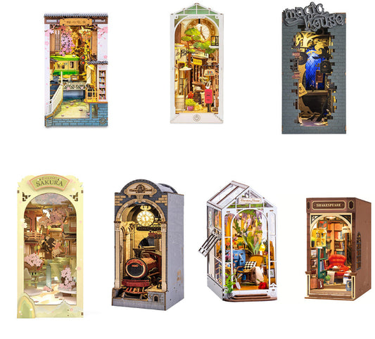 Collection of miniature model houses in various designs and settings.