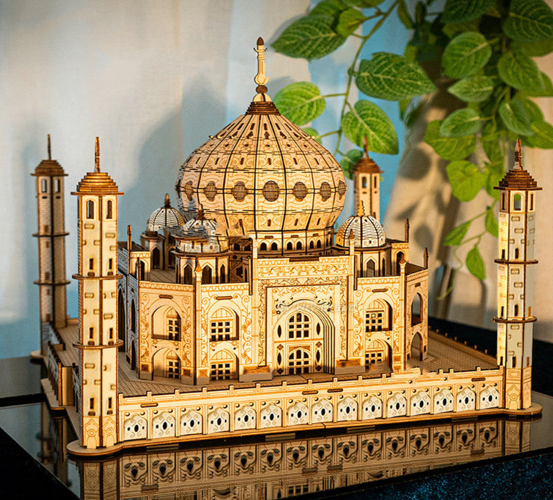 Model of a Taj Mahal-like building with intricate details on a reflective surface.