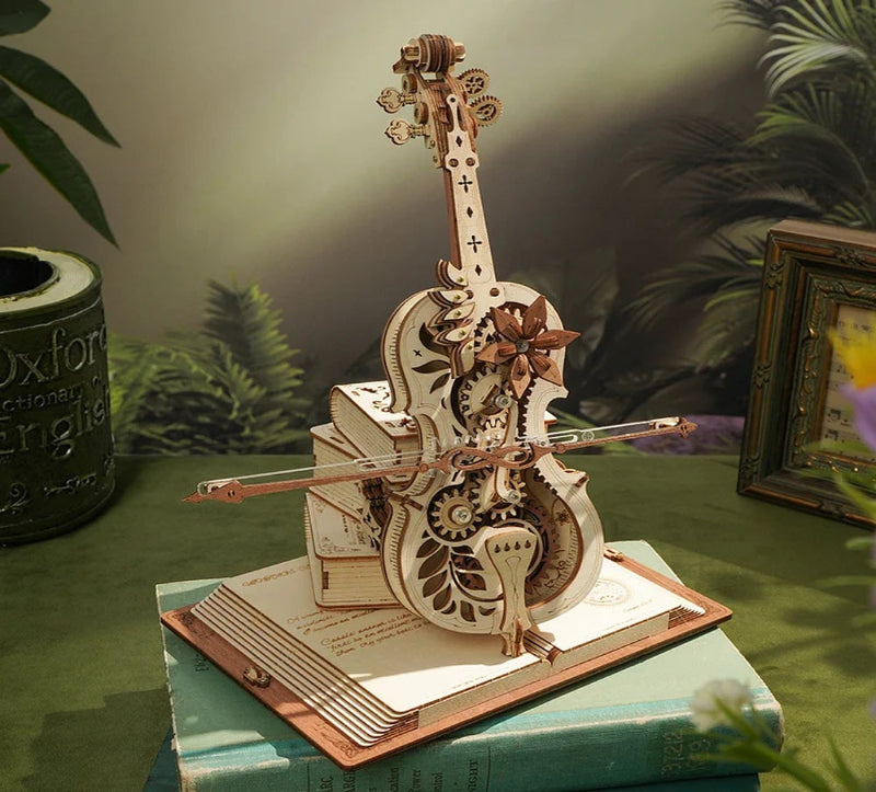 Wooden musical instrument model on a book with a blurred natural background