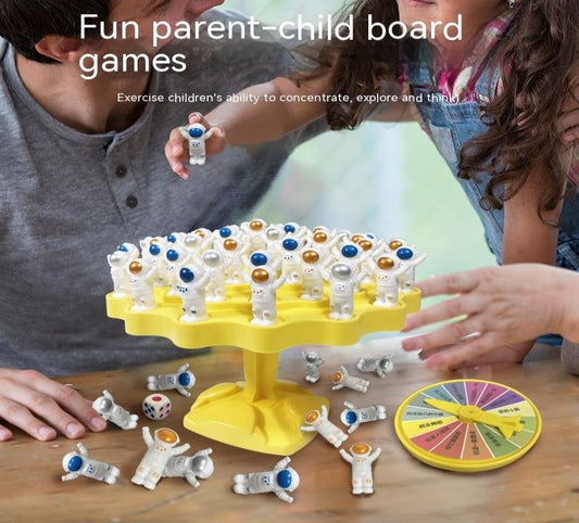 Two children playing with a colorful board game on a wooden table.