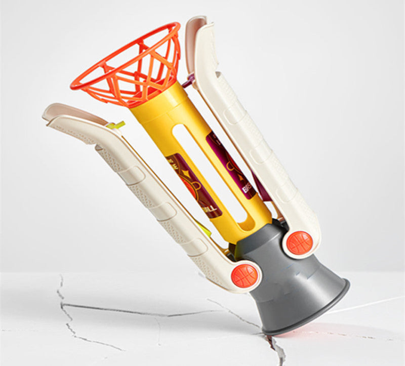 Toy basketball hoop with a white backboard and orange rim on a light gray background