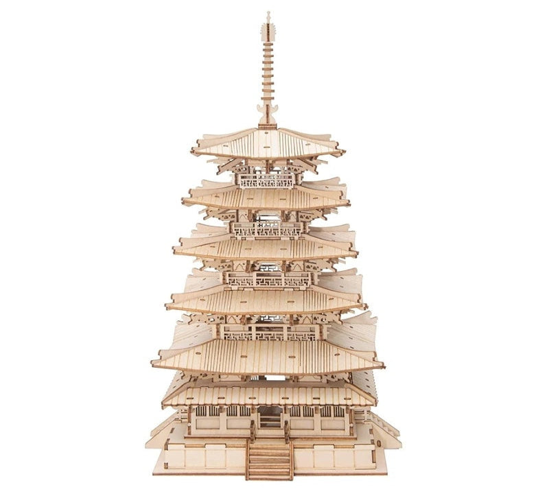A completed 3D wooden pagoda model with multiple tiered roofs and a spire.