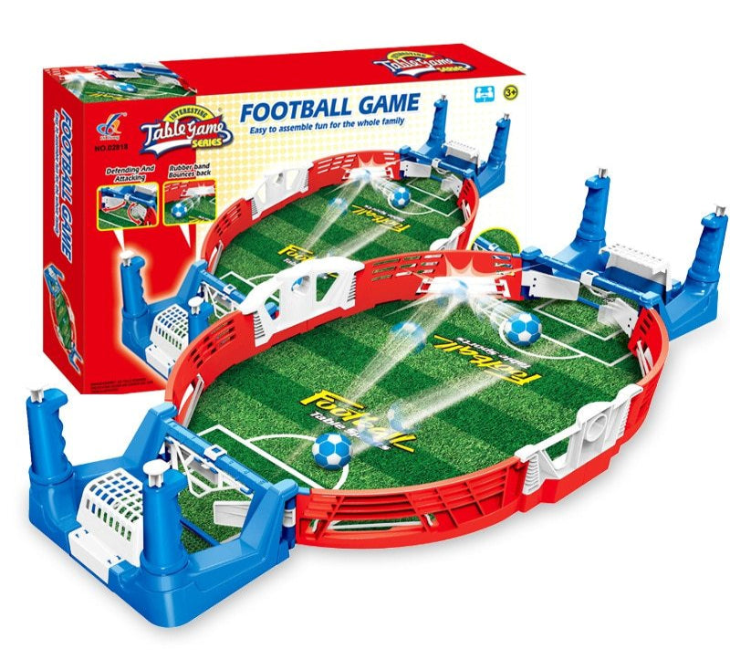 Tabletop football game set with red and blue border, featuring a miniature soccer field and goalposts.