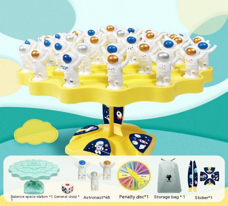 Toy set with astronauts and space-themed elements on a yellow stand against a colorful background.