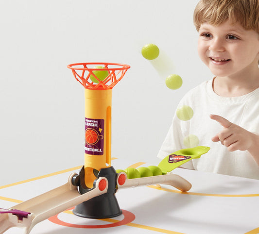 Child playing with a toy basketball set on a white background
