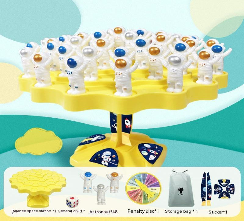 Toy set with astronauts and space-themed elements on a yellow stand against a colorful background.